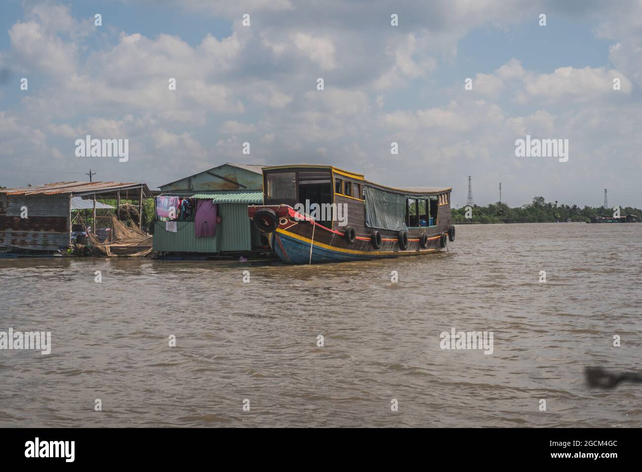 Floating house on the Mekong River in Vietnam, South East Asia. Vung
