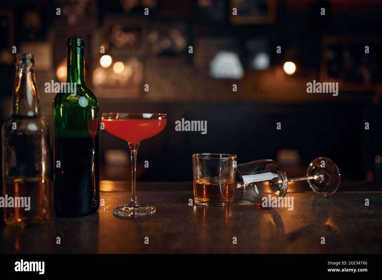 Different alcohol beverages on counter in bar Stock Photo
