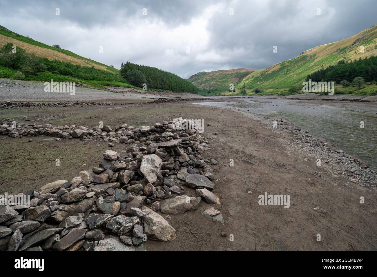 The dry lake bed of the Haweswater reservoir in the English Lake District, Cumbria, showing the old field walls of Mardale Lost Village Stock Photo