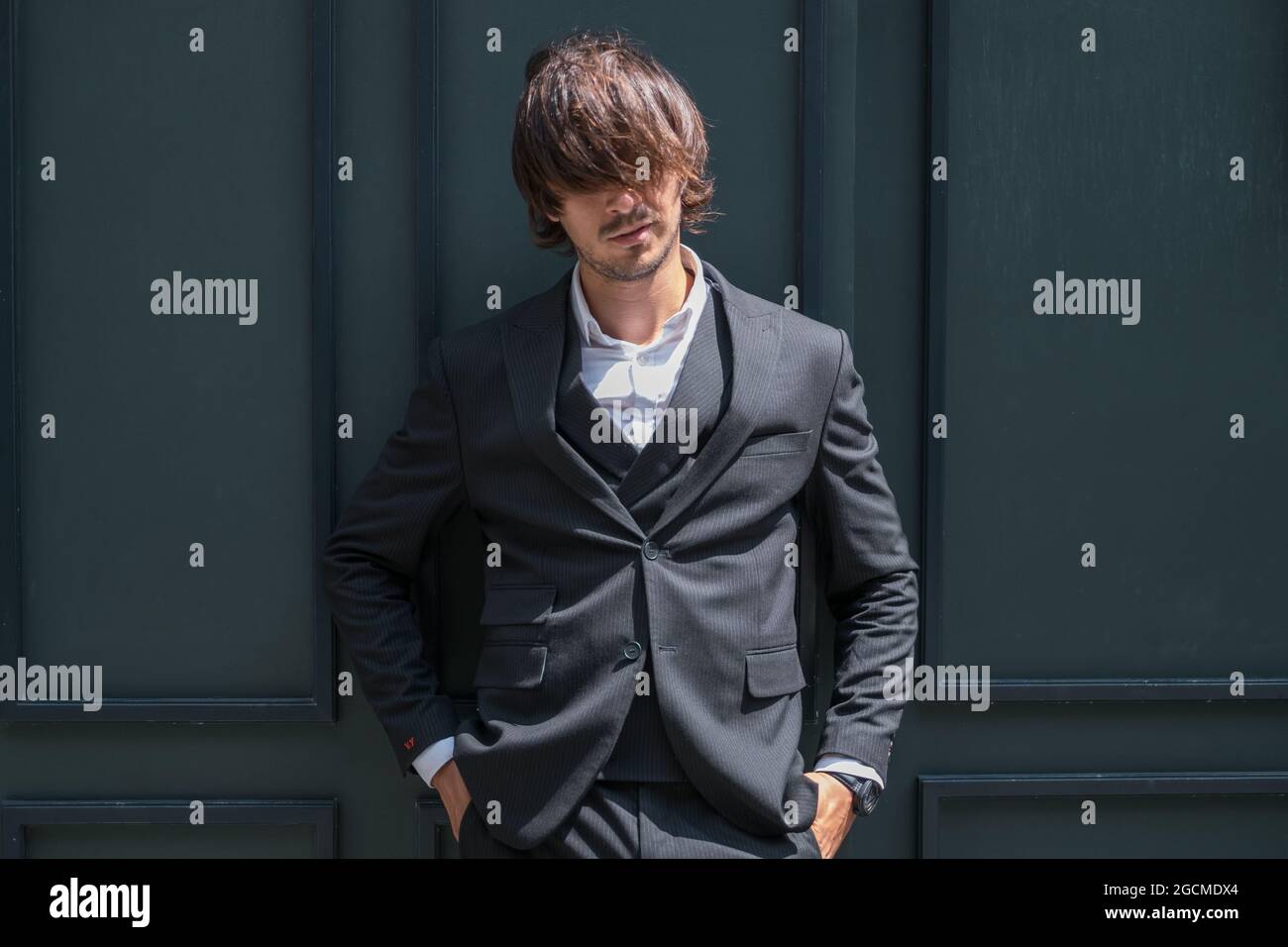Dark green suit hi-res stock 