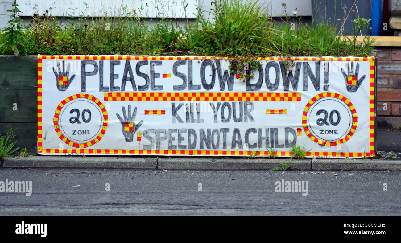 'Please slow down, kill your speed not a child 20 mph' sign in Manchester, England, UK Stock Photo