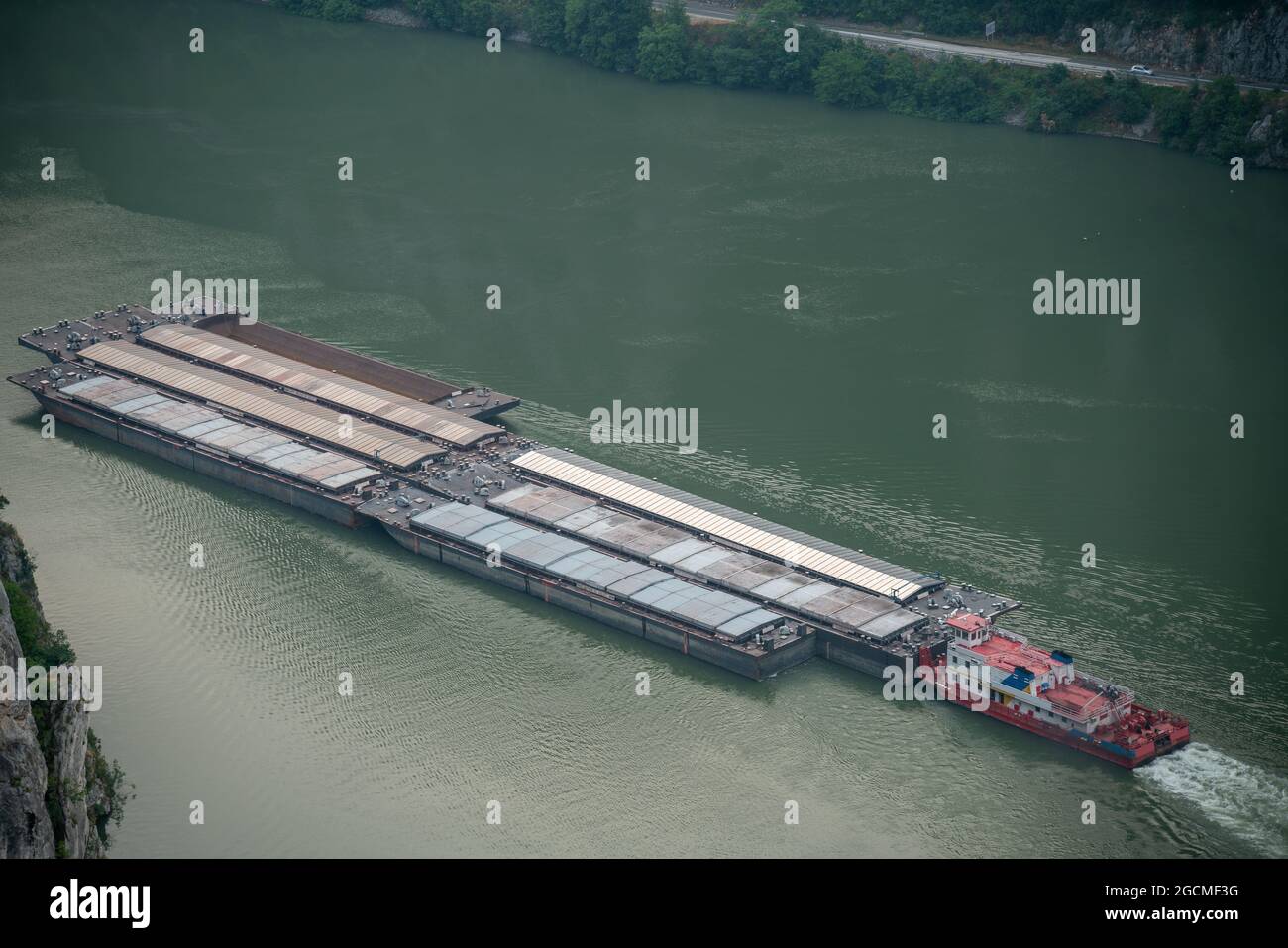 Barges Transport flowing Danube breakthrough, known as the Iron Gates Stock Photo