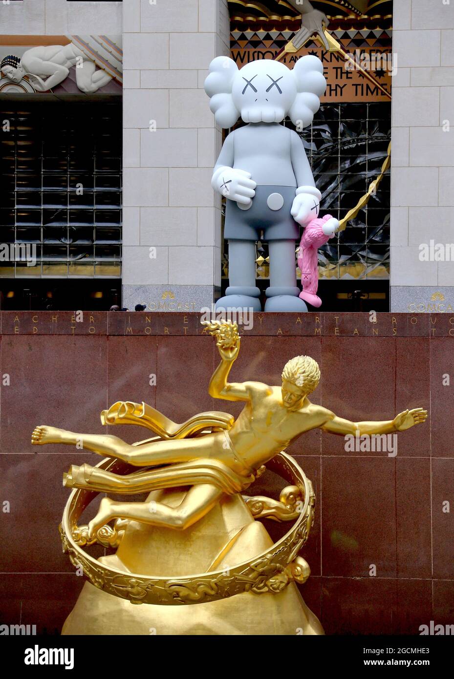 Kaws Statue by artist Brian Donnelly at The Rockefeller Center Plaza in Midtown, New York, NY on