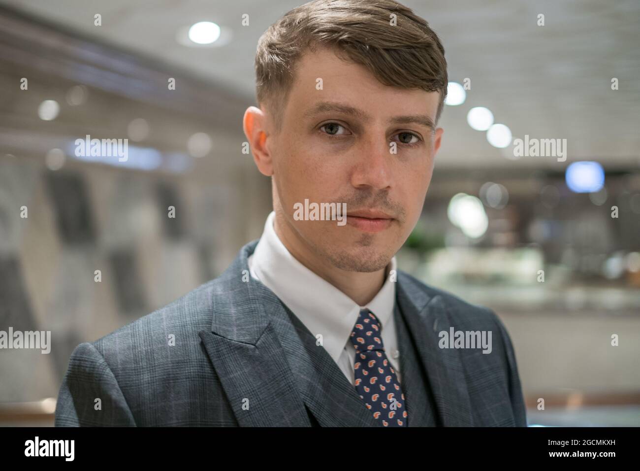 Close-up portrait of handsome young man with light brown hair. Wearing grey classic suit. High quality photo Stock Photo - Alamy Close-up portrait of handsome young man with light brown hair. Wearing grey classic suit. High quality photo Stock Photo - Alamy