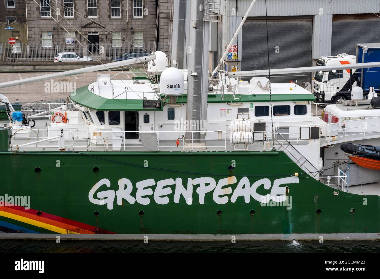 The Greenpeace logo on the side of Rainbow Warrior in Aberdeen harbour. Stock Photo