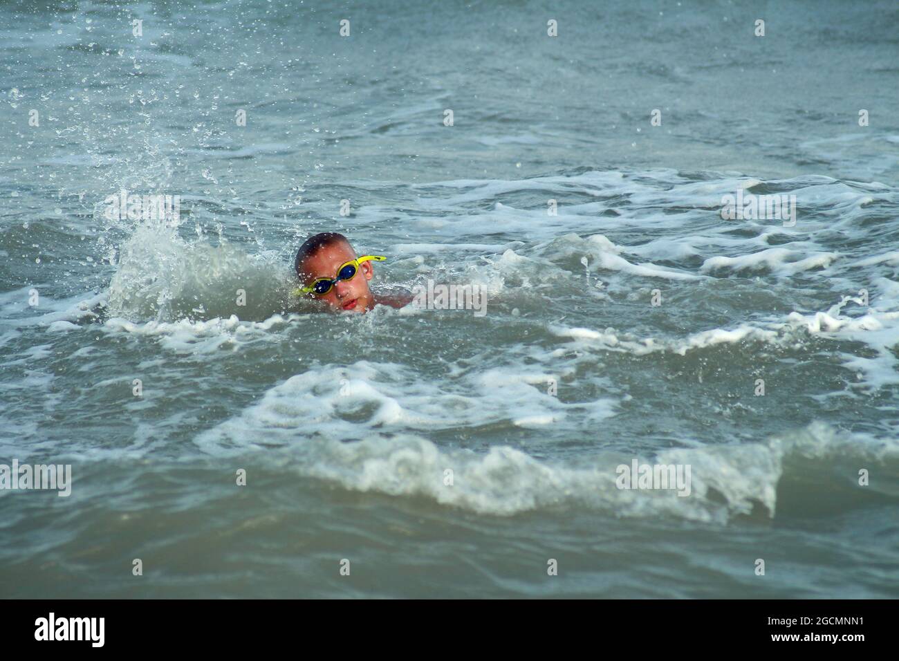 Boy swimming in the sea water Stock Photo - Alamy