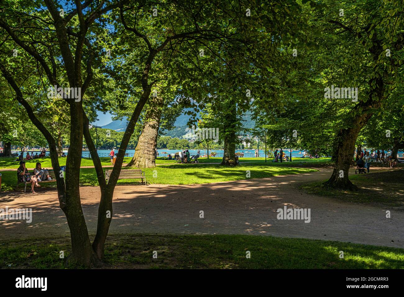 Garden of Europe in Annecy, tourists and locals alike enjoy the shade of the plants in this city park on a sunny summer day. Annecy, France Stock Photo