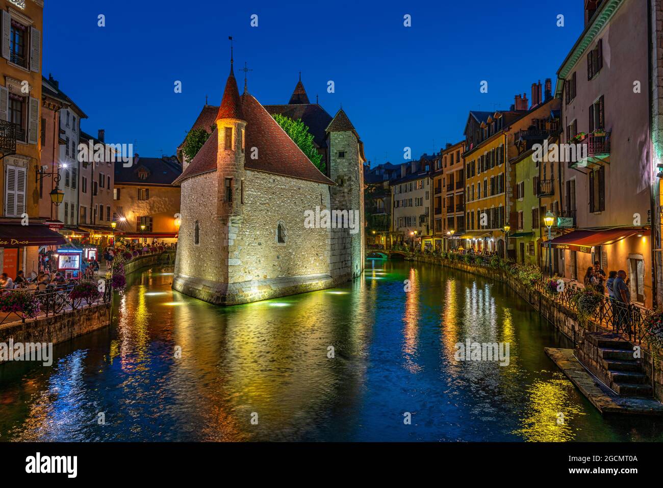 The old prisons of the city of Annecy have now become a tourist attraction. Along the canals, cafes and restaurants abound. Annecy, France Stock Photo
