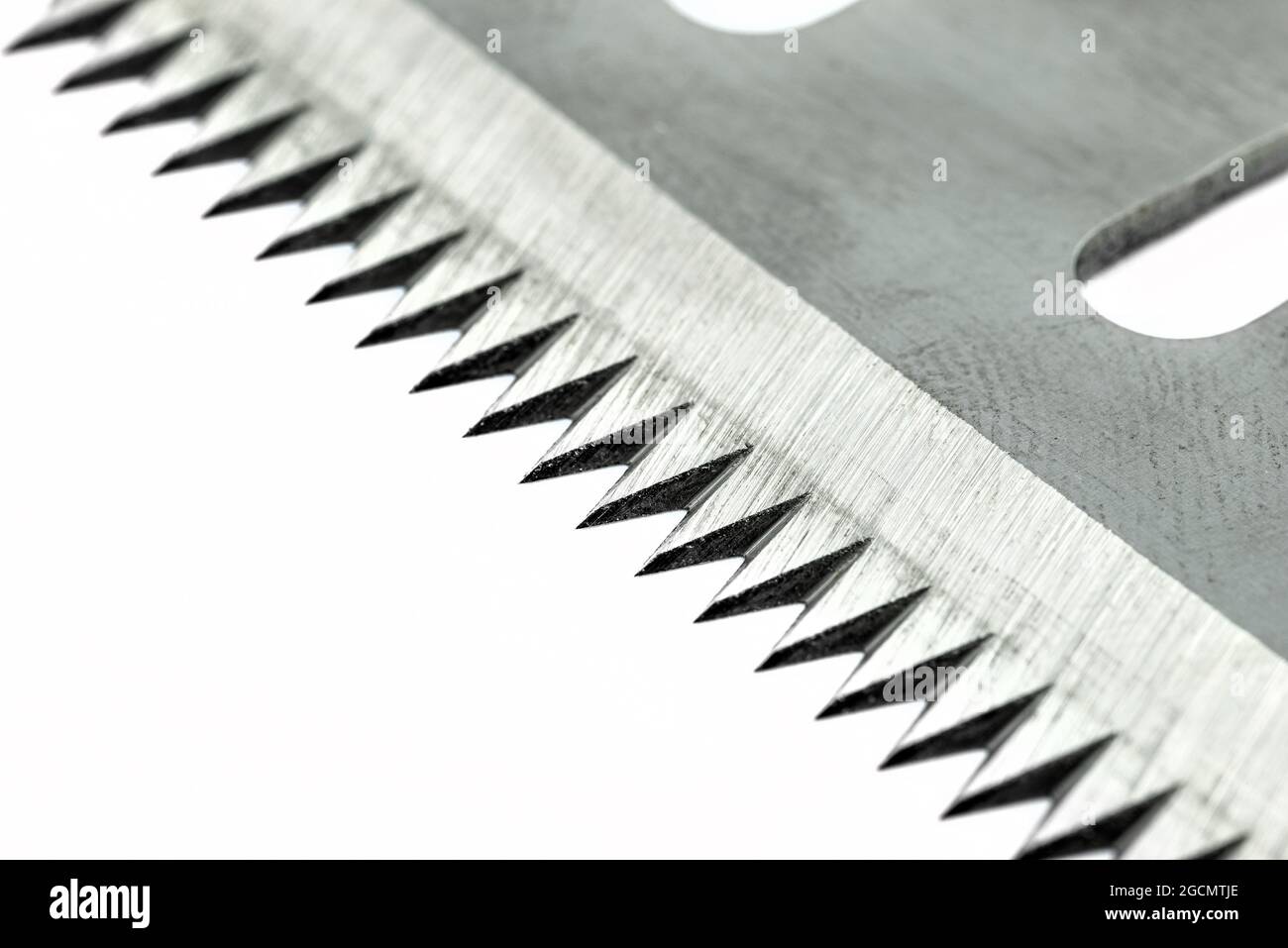 A macro photo of a serrated industrial blade for tape cutters, isolated ...