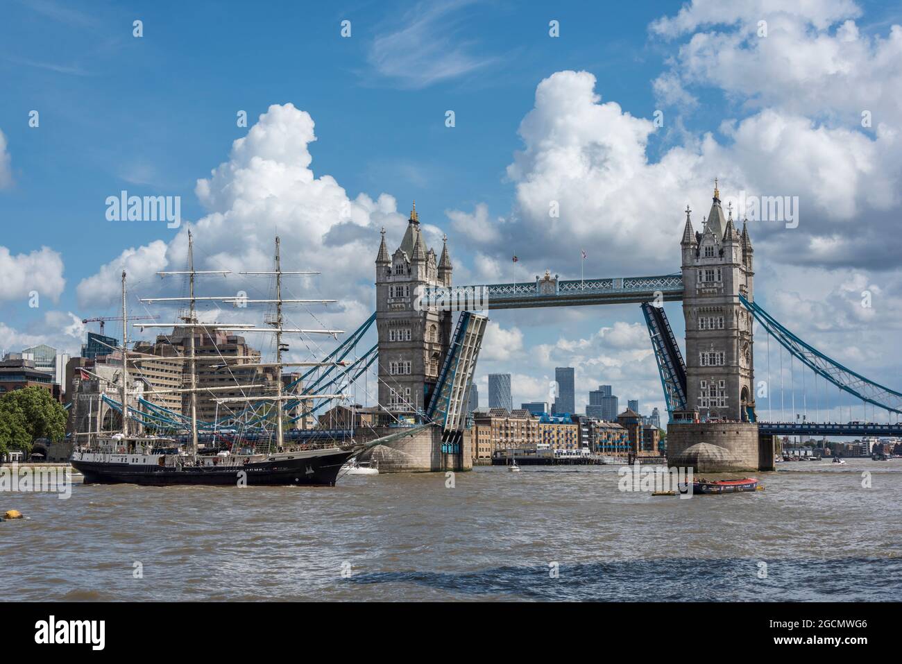 The Tenacious tall ship sailing ship passing through Tower Bridge in ...