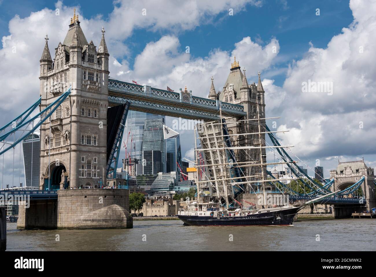 The Tenacious tall ship sailing ship passing through Tower Bridge in ...