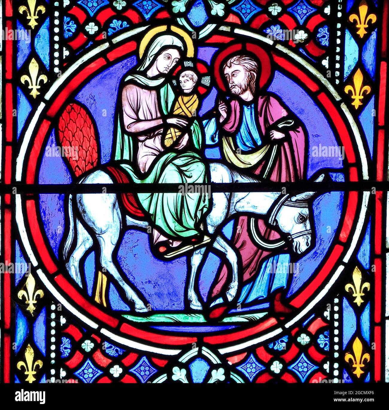 Nativity Window, stained glass by Oudinot of Paris, 1861, Feltwell Church, Norfolk.  Mary, Joseph and baby Jesus, flee to Egypt, Flight to Egypt Stock Photo