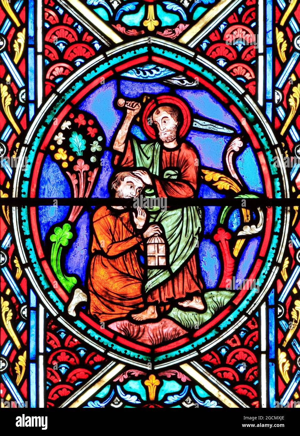 Simon Peter, St. Peter, cuts off ear of Malchus, servant of Caiaphas, with sword, in Garden of Gethsemane, for betraying Jesus, stained glass, Passion Stock Photo