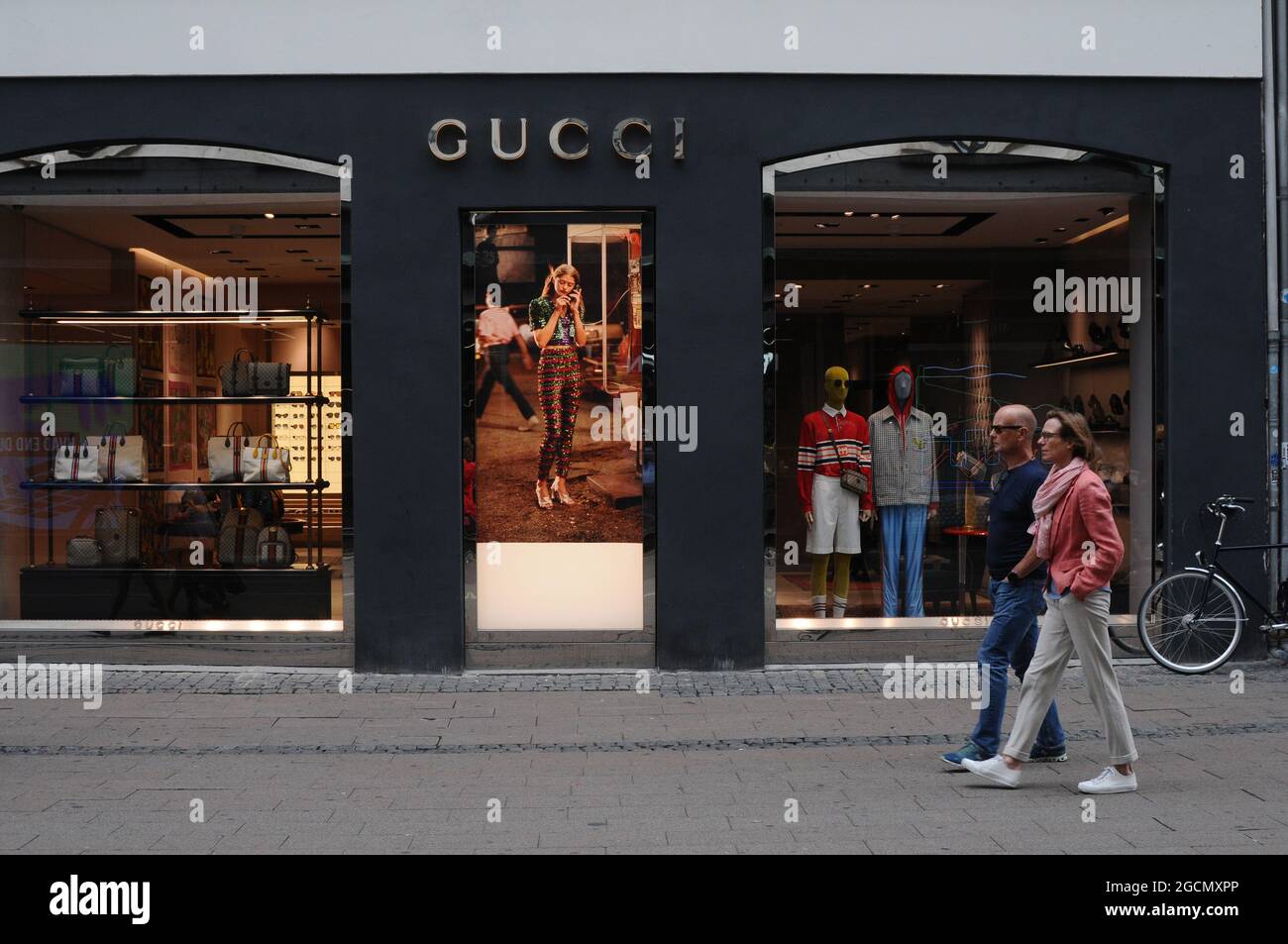 Copenhagen, Denmark.,09 August 2021,/Tourists and shopper pass by Gucci  store on Stroeget financial street in danish capital. (Photo..Francis Jose  Stock Photo - Alamy