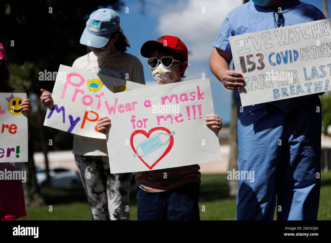 Supporters of wearing masks in schools Sofia Deyo 11, and her brother Matthew Deyo 6, protest before the special called school board workshop at the Pinellas County Schools Administration Building in Largo, Florida, U.S., August 9, 2021. REUTERS/Octavio Jones Stock Photo