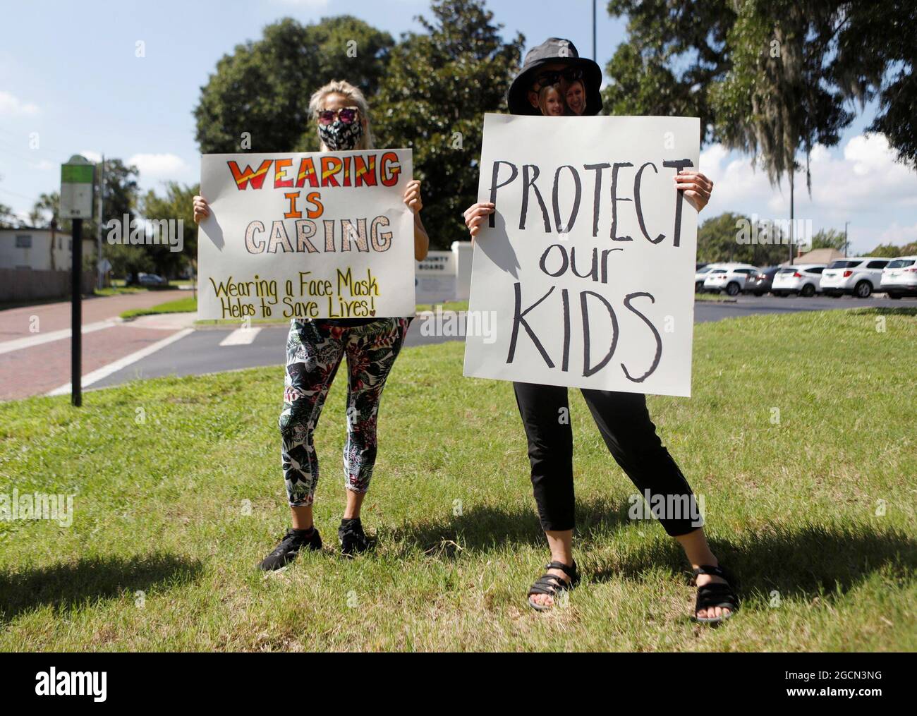 Supporters of wearing masks in schools protest before the special called school board workshop at the Pinellas County Schools Administration Building in Largo, Florida, U.S., August 9, 2021. REUTERS/Octavio Jones Stock Photo