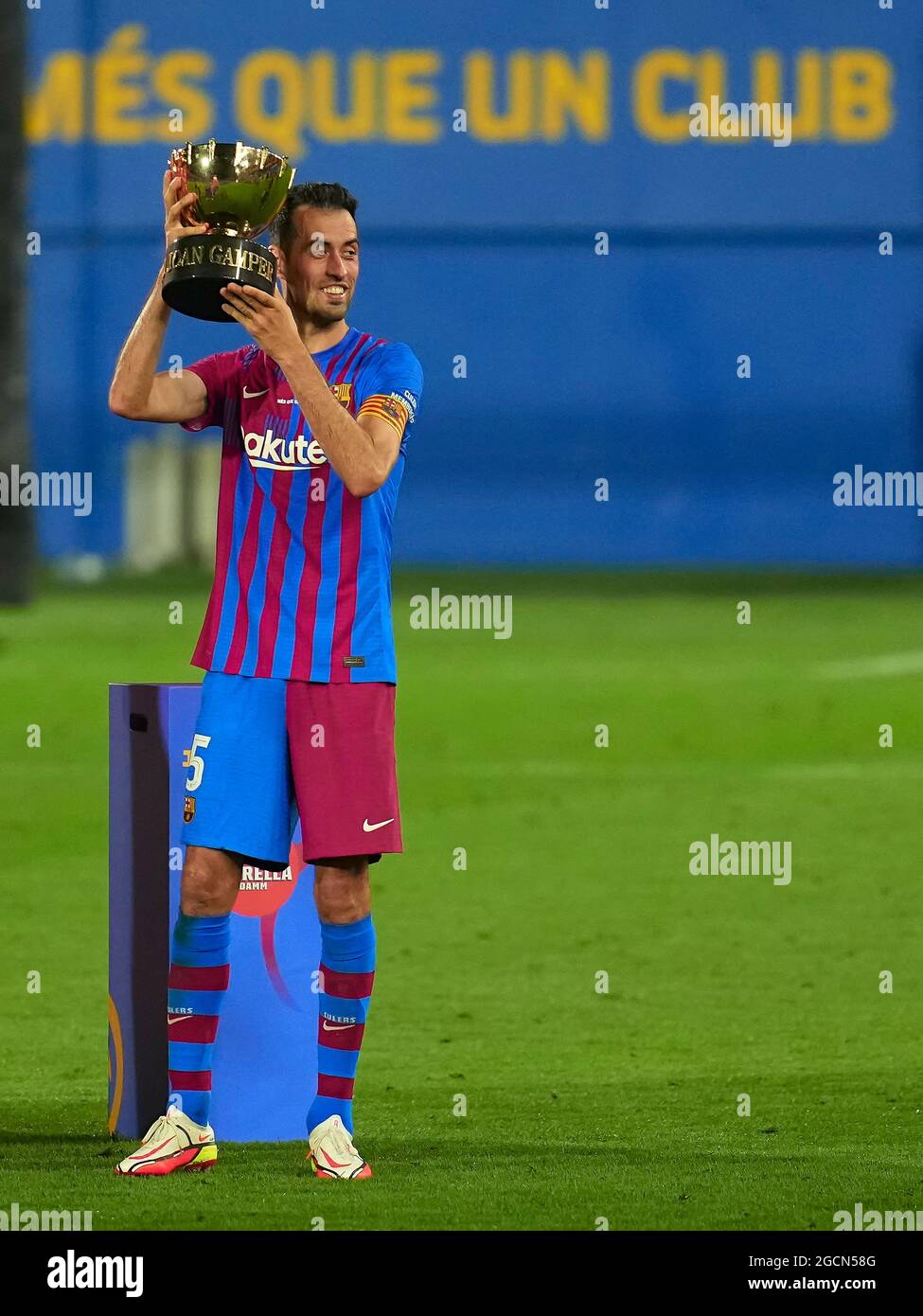 Sergio Busquets of FC Barcelona with the winner's trophy during the