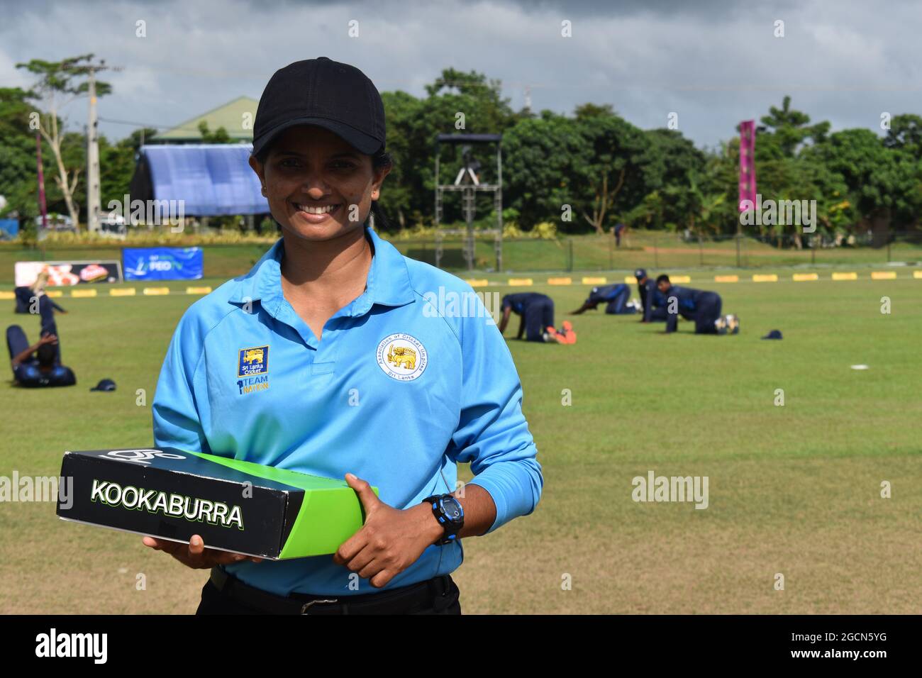 Portrait of a Sri Lanka female umpire at a cricket match at the Army Ordinance cricket grounds, Dombagoda. Females who have been involved with cricket as players are taking up umpiring and scoring to be involved with the game. Sri Lanka. Stock Photo