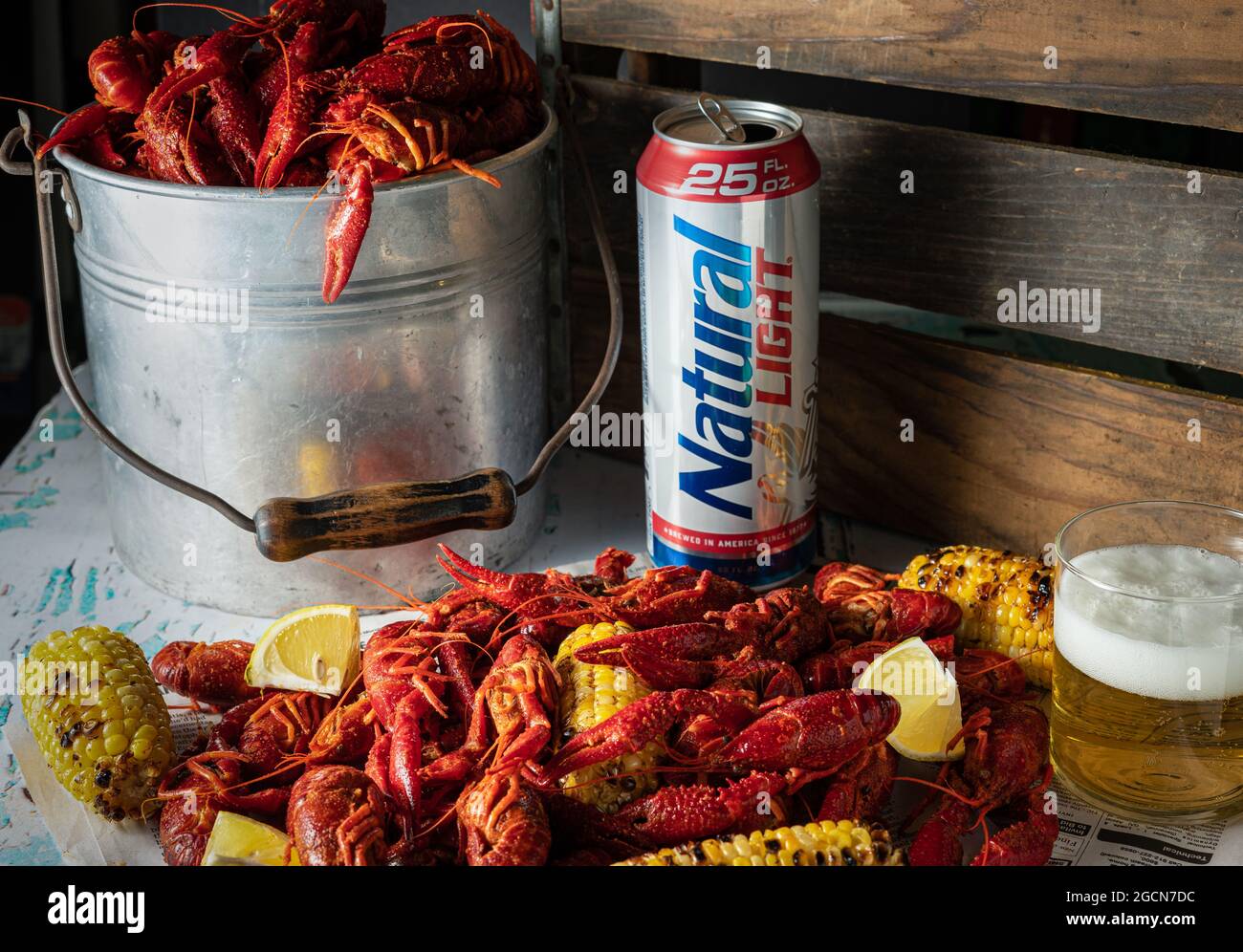 Natural Light beer with steamed crawfish and grilled corn. Stock Photo