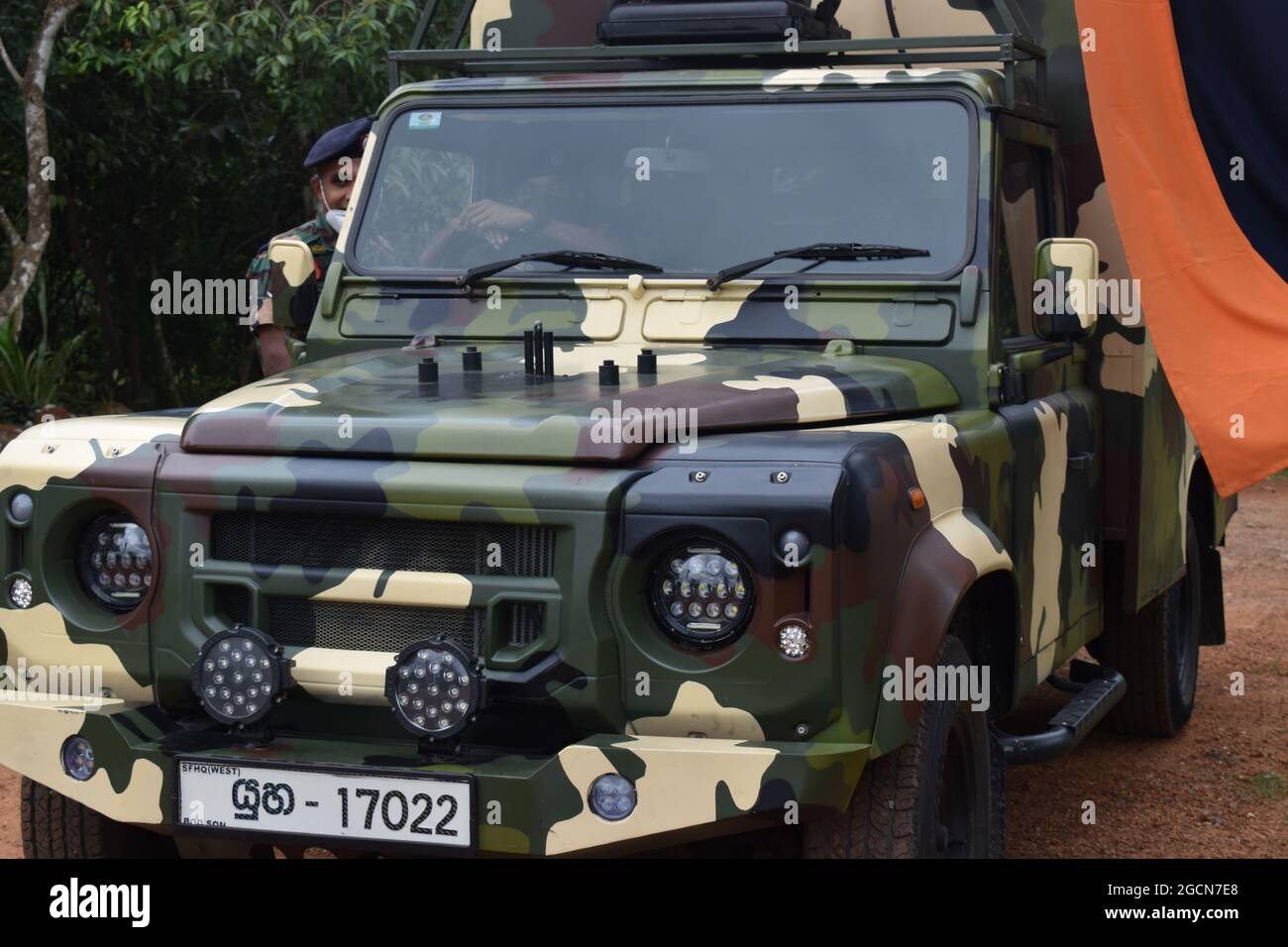 Army jeep. At the picturesque Army Ordinance cricket grounds. Dombagoda. Sri Lanka. Stock Photo