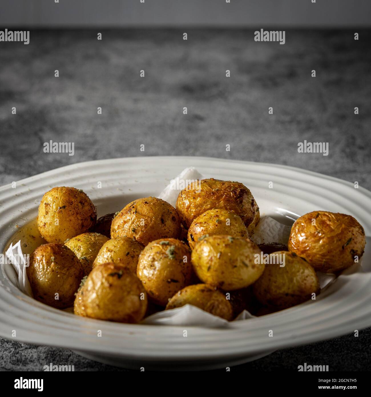 Roasted baby yellow potatoes. Stock Photo