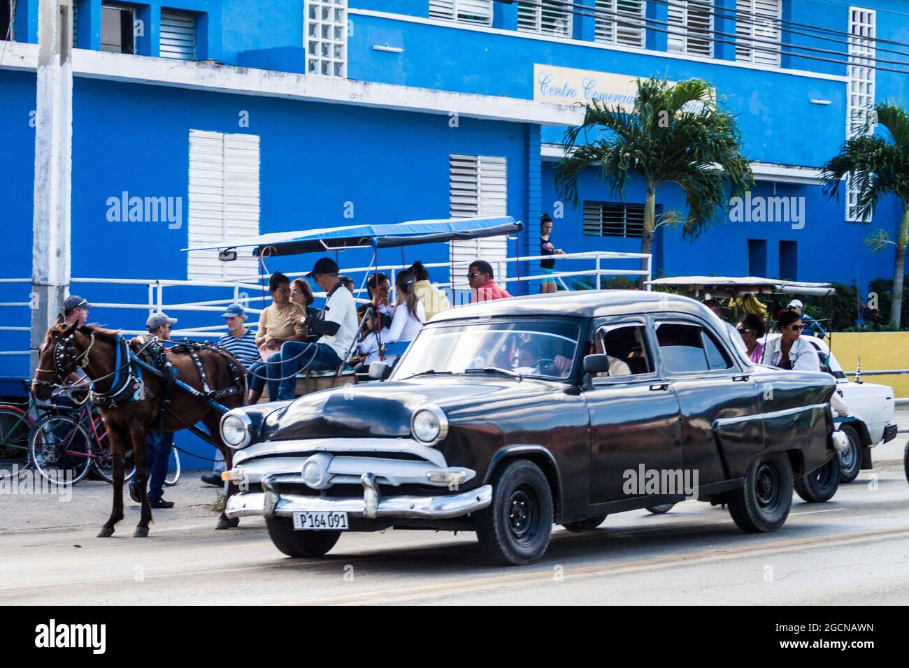 CAMAGUEY, CUBA JAN 26, 2016 Horse carriage and an old car, common