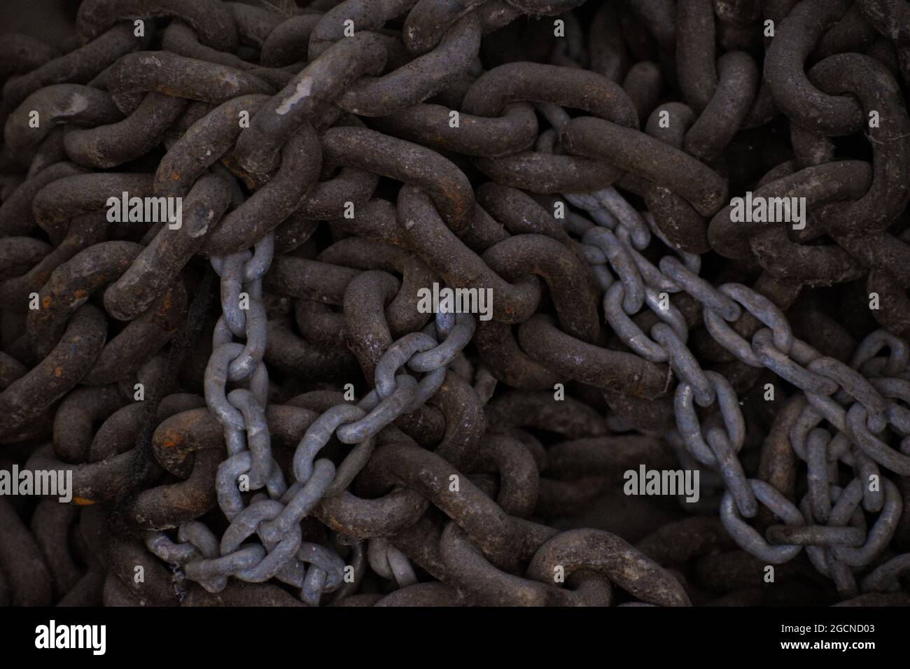 High angle shot of rusted and old chains tangled together Stock Photo