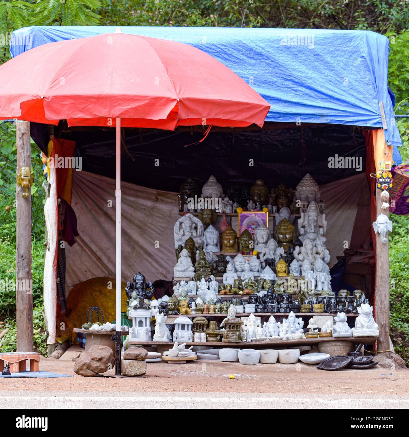 Street market selling religious statues and decoratives Stock Photo Alamy