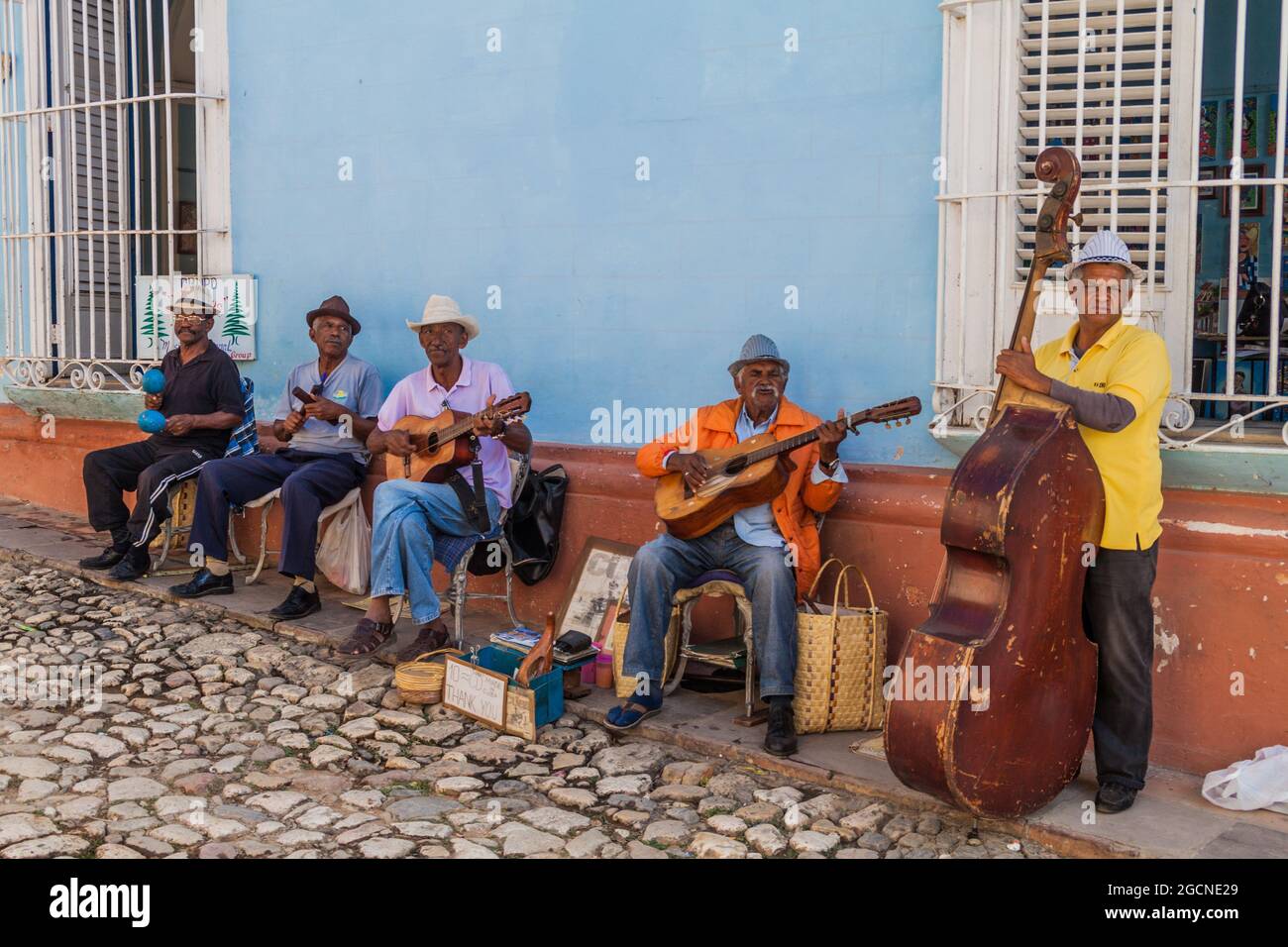 TRINIDAD, CUBA - FEB 8, 2016: Group of local musicians plays on a street in the center of Trinidad, Cuba. Stock Photo