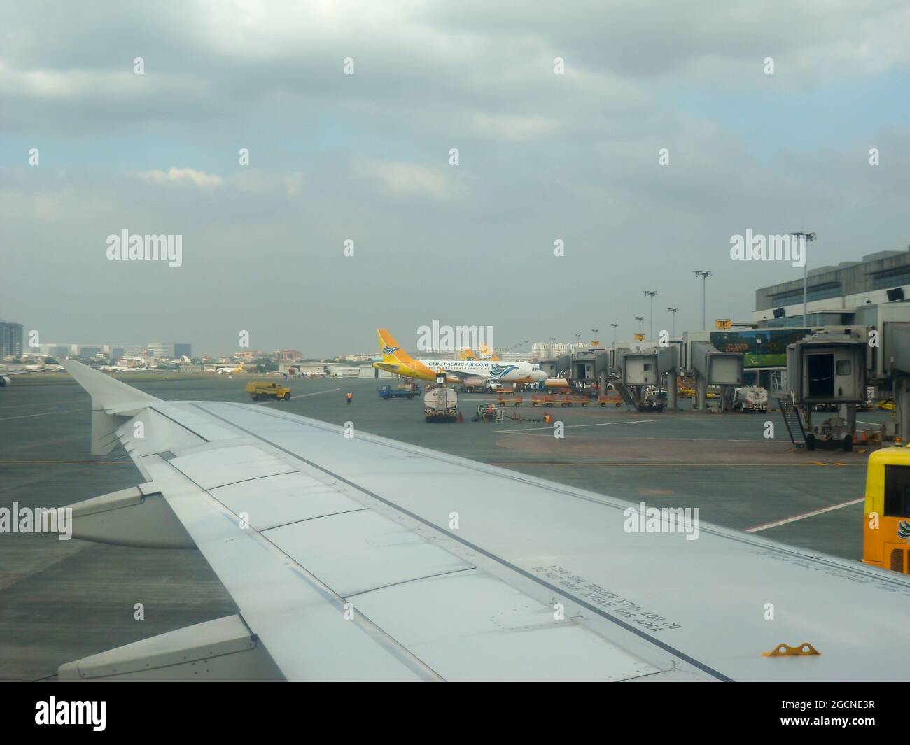 View to the apron from an Airbus A320 of the international airport in Manila on the Philippines 14.12.2012 Stock Photo