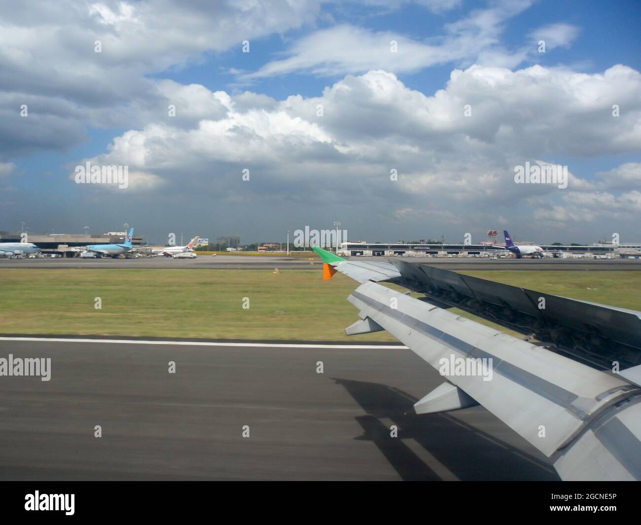 Touch down with spoilers on the international airport in Manila on the Philippines 21.12.2012 Stock Photo