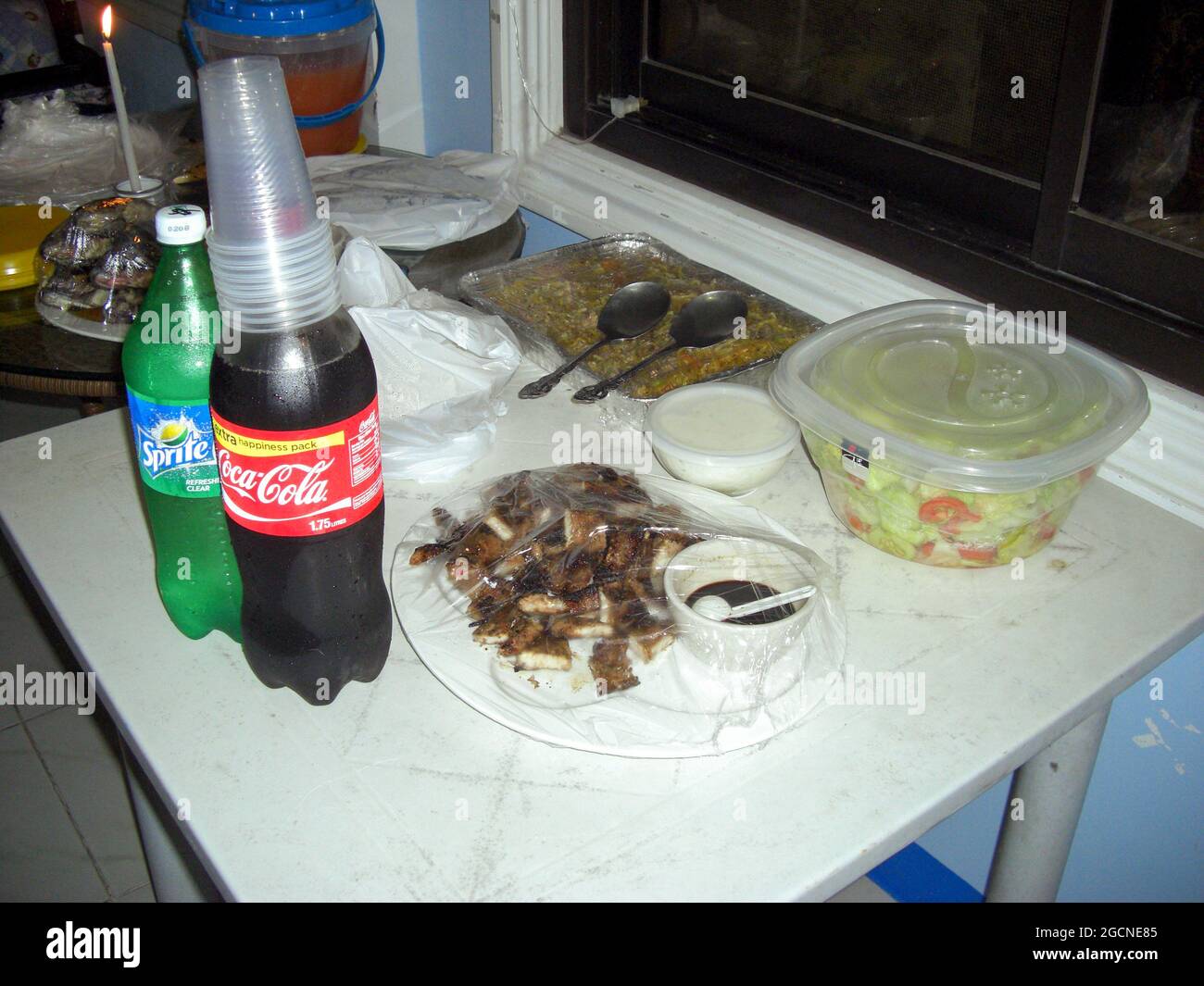 Table is prepared with some food and drinks in Sabang at the Philippines 9.12.2016 Stock Photo
