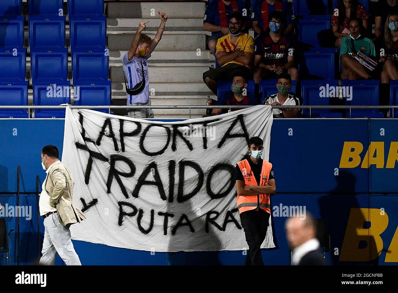Sant Joan Despi, Spain. 08 August 2021. A banner against Joan Laporta is displayed by a FC Barcelona fan during the pre-season friendly football match between FC Barcelona and Juventus FC. FC Barcelona won 3-0 over Juventus FC. Credit: Nicolò Campo/Alamy Live News Stock Photo