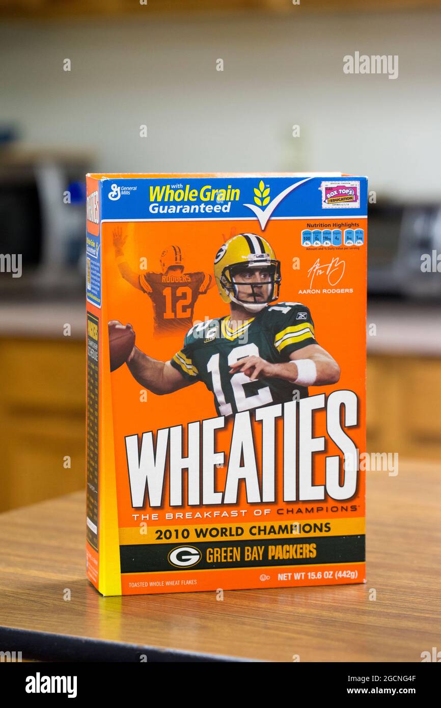 A Wheaties breakfast cereal box with photos of Green Bay Packers quarterback Aaron Rodgers sitting on a kitchen counter. Stock Photo