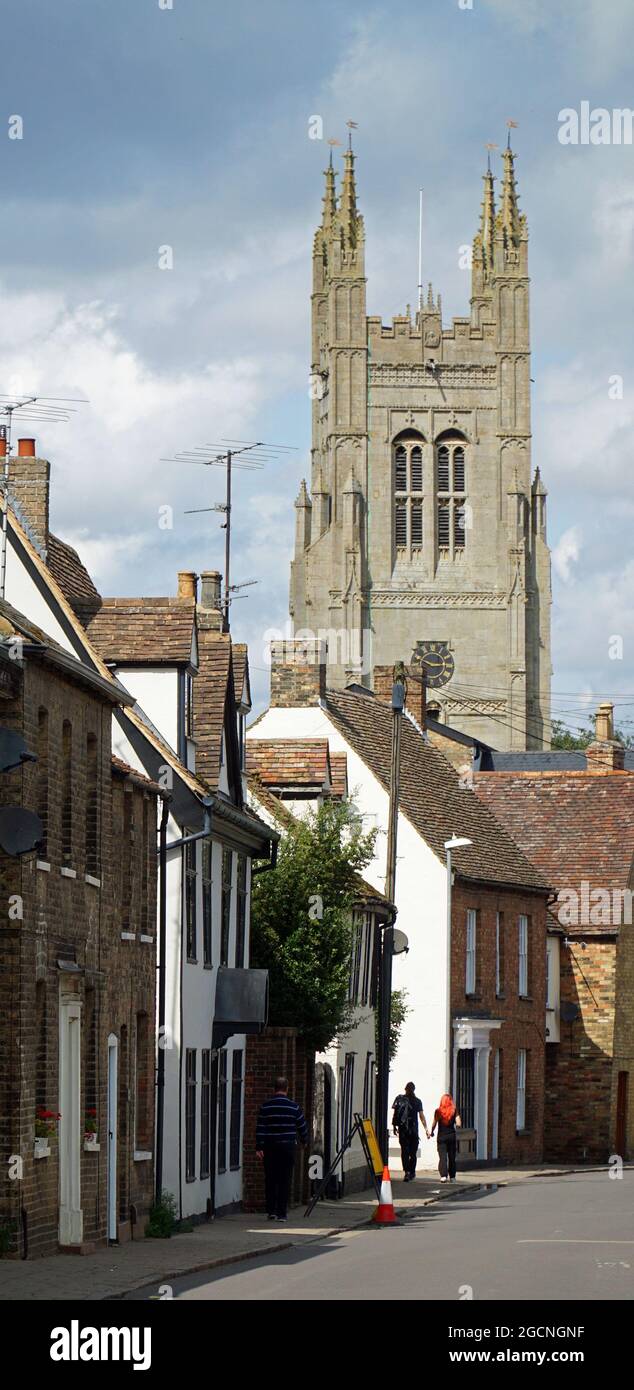 St Mary's  Street Eynesbury  with the tower of St Mary's church St Neots in background Vertical Format. Stock Photo
