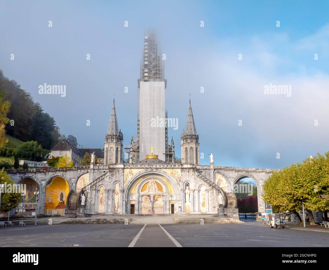 LOURDES, FRANCE - October 12, 2020:  Basilica Our Lady of the Rosary covered with scaffolding, Lourdes, France. Stock Photo