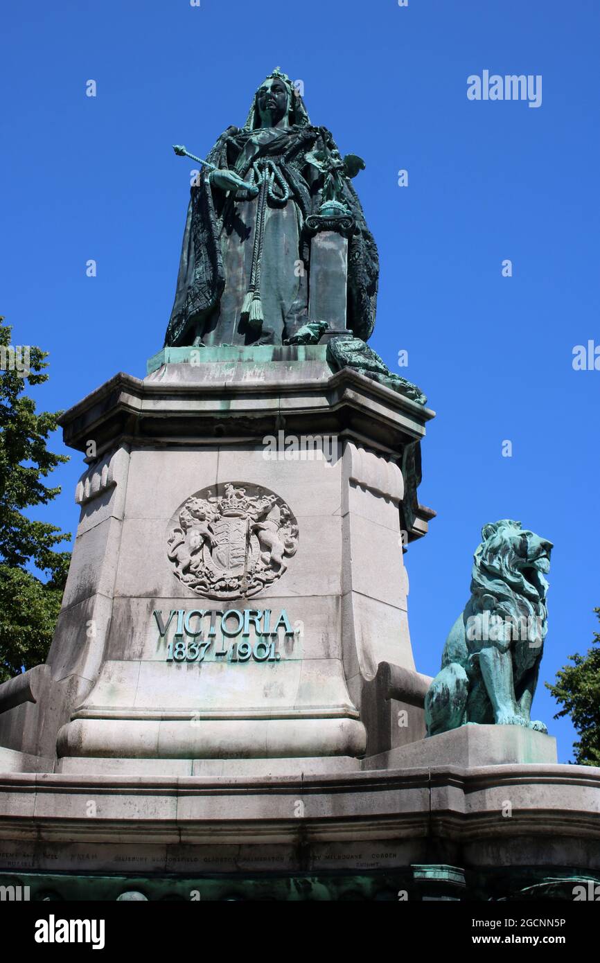 top part of Queen Victoria memorial Dalton Square, Lancaster, England with bronze sculpture Queen Victoria on Portland stone plinth with bronze lion. Stock Photo