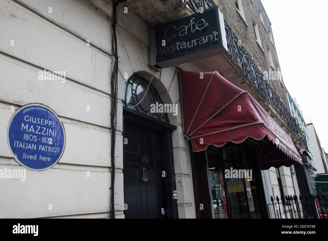 London, UK. 5th August, 2021. A blue ceramic plaque bears Giuseppe Mazzini's name. It was installed in honour of the Italian patriot at 183 North Gower Street in Bloomsbury by London County Council in 1950. Credit: Mark Kerrison/Alamy Live News Stock Photo