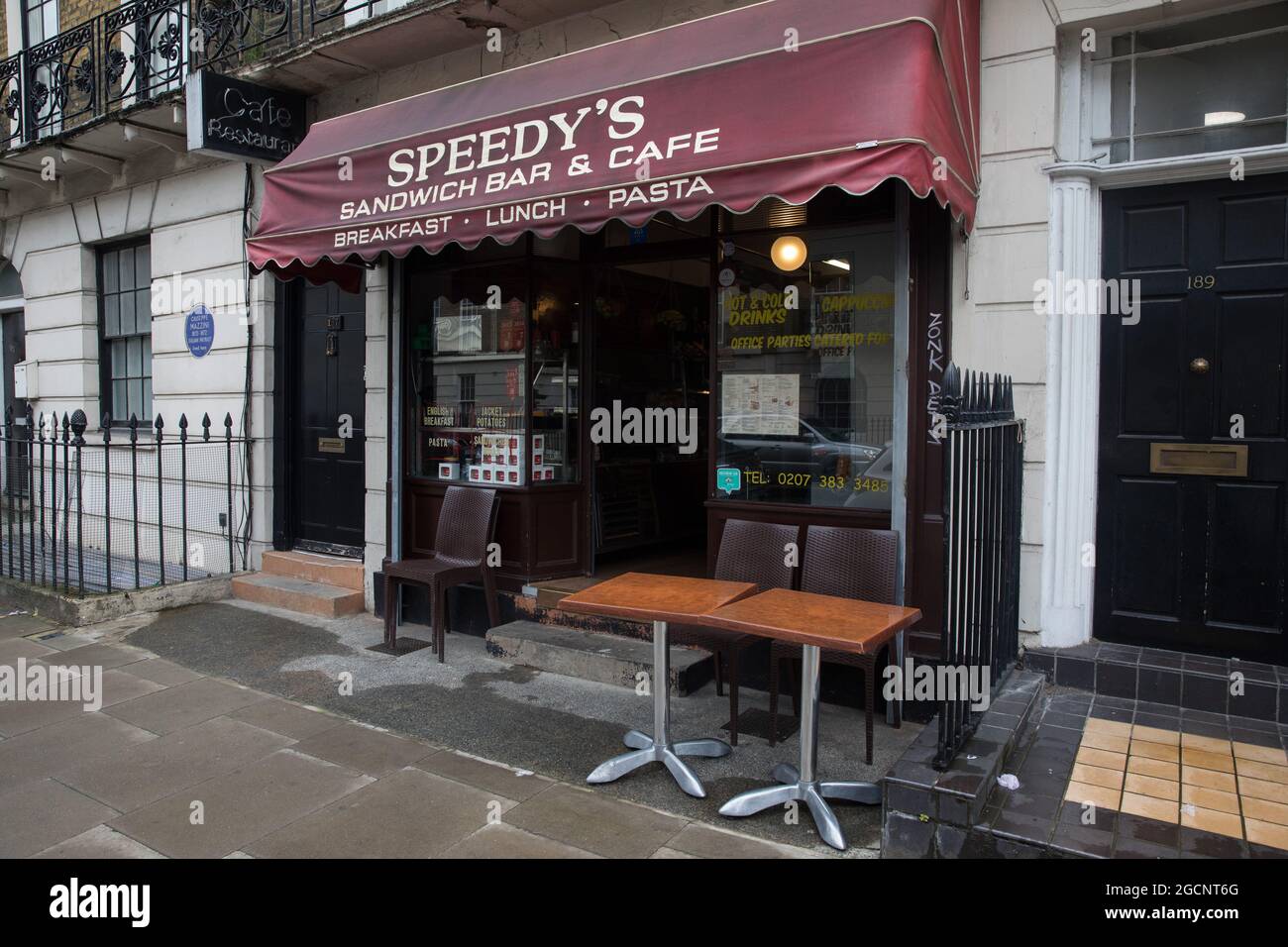 London, UK. 5th August, 2021. A view of the exterior of Speedy's Sandwich Bar and Cafe in Bloomsbury. A ceramic blue plaque bearing the name of Italian patriot Giuseppe Mazzini was installed on the adjoining property by London County Council in 1950. Credit: Mark Kerrison/Alamy Live News Stock Photo