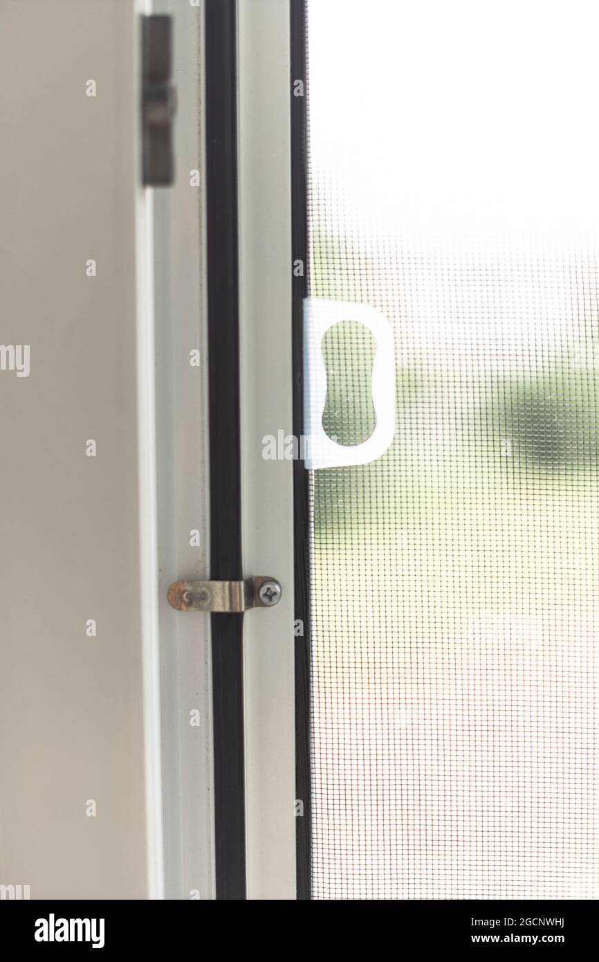 Mosquito net frame on PVC window Stock Photo Alamy