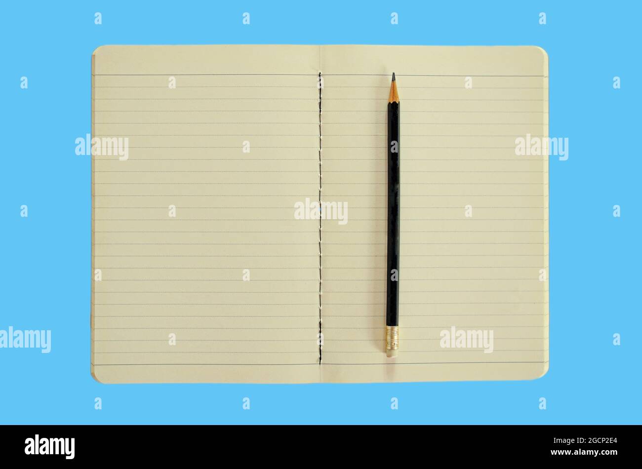 Open notebook with pencil isolated on blue background Stock Photo