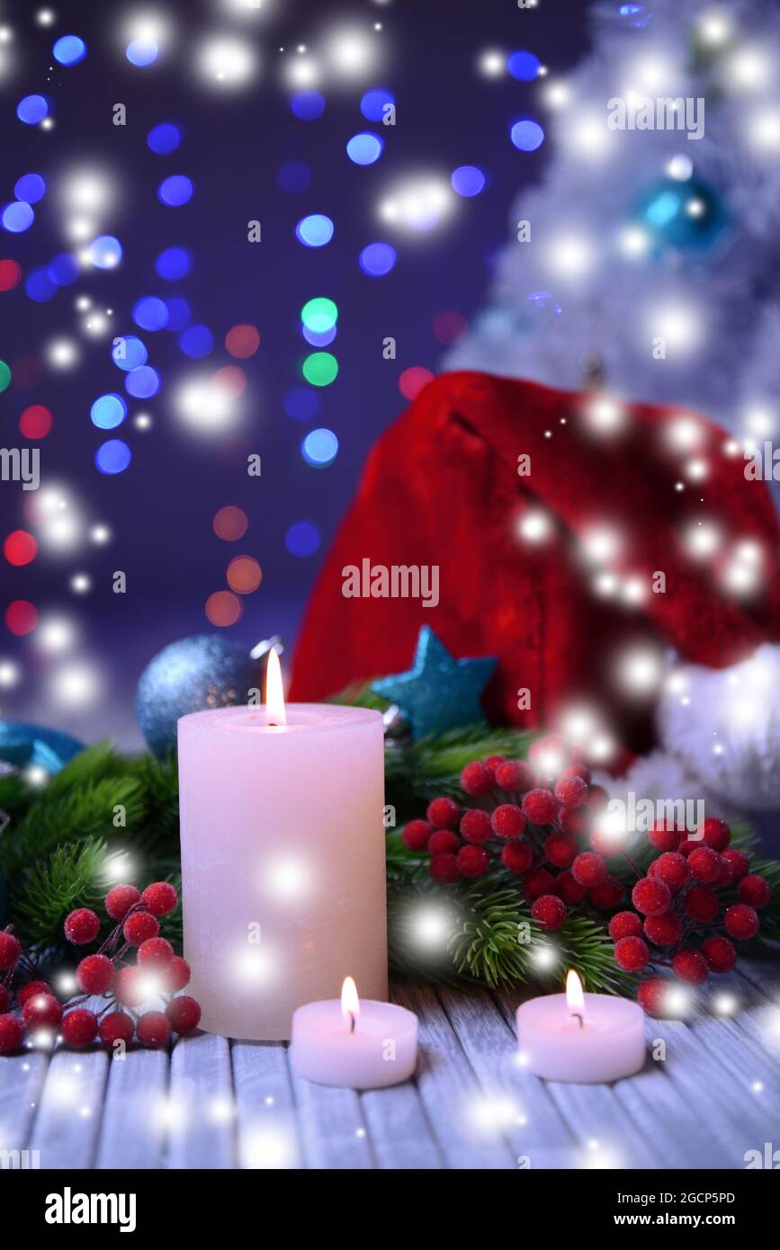 Candles and Christmas decoration on bright background Stock Photo - Alamy