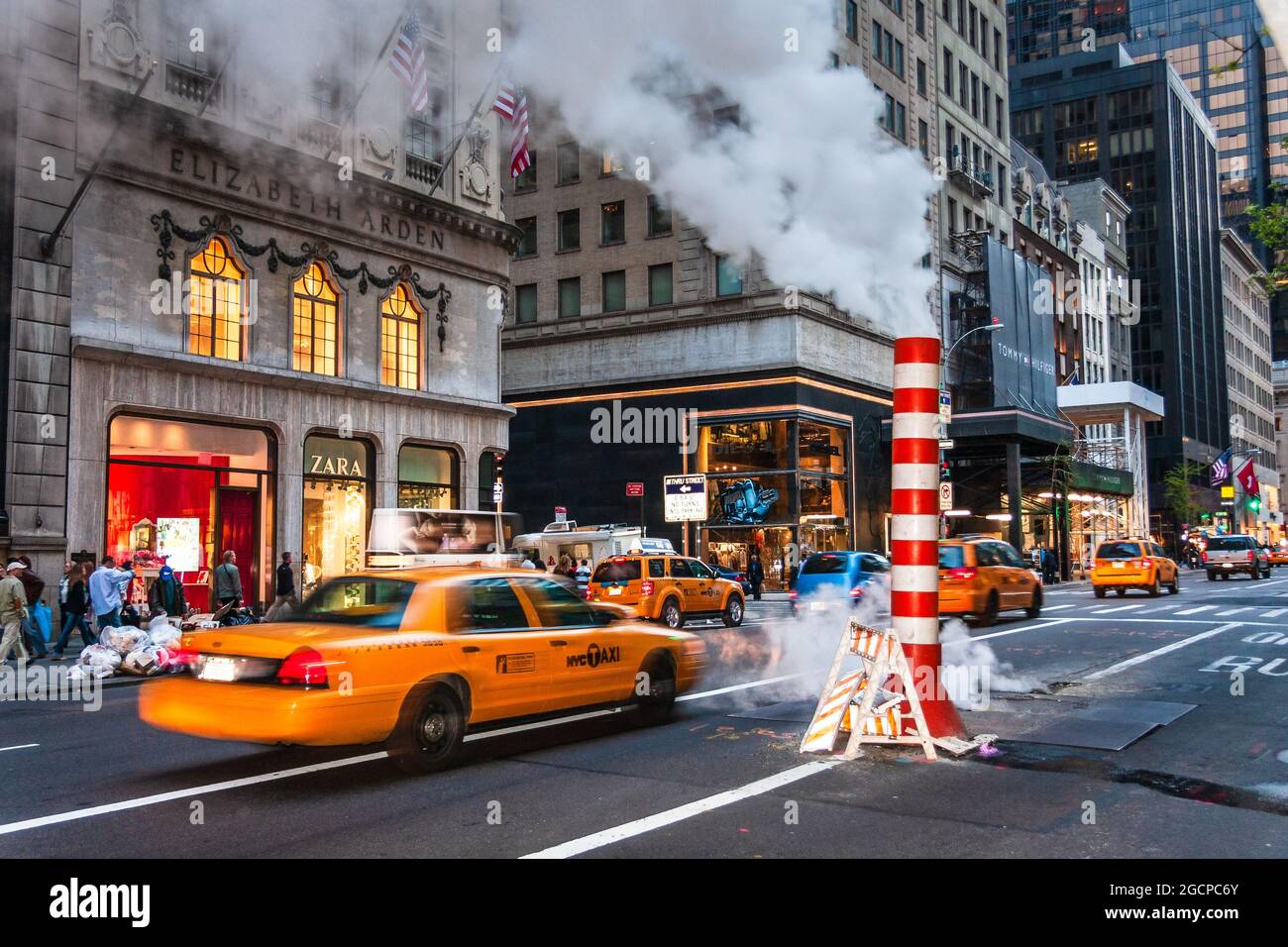 Fifth Avenue and 54th Street, New York City, NY, USA. Steam vents from Con Edison's Steam Operations. Stock Photo