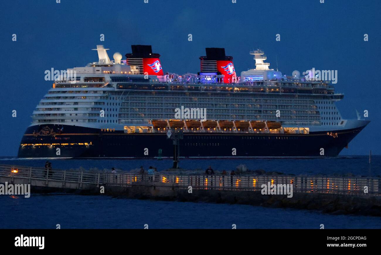 Disney Dream, a Disney Cruise Lines' ship, sails to the Bahamas on the first Disney cruise for paying customers since they were stopped during the coronavirus disease (COVID-19) pandemic, from Port Canaveral in Florida, U.S., August 9, 2021. REUTERS/Joe Skipper Stock Photo