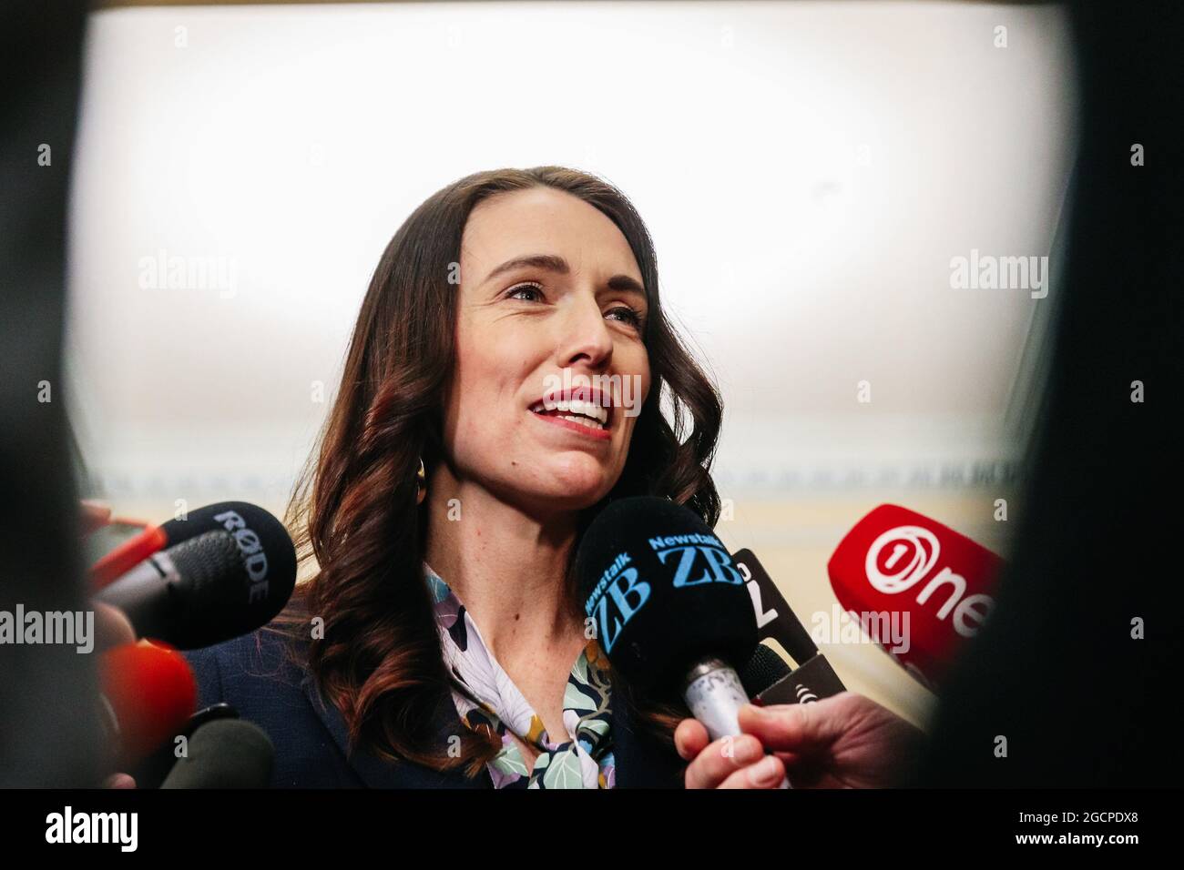 Wellington, New Zealand, 10 August 2021. New Zealand Prime Minister Jacinda Ardern smiles as she talks to press gallery reporters about overnight power outages triggered by high electricity demand during a winter cold snap.  Credit: Lynn Grieveson/Alamy Live News Stock Photo