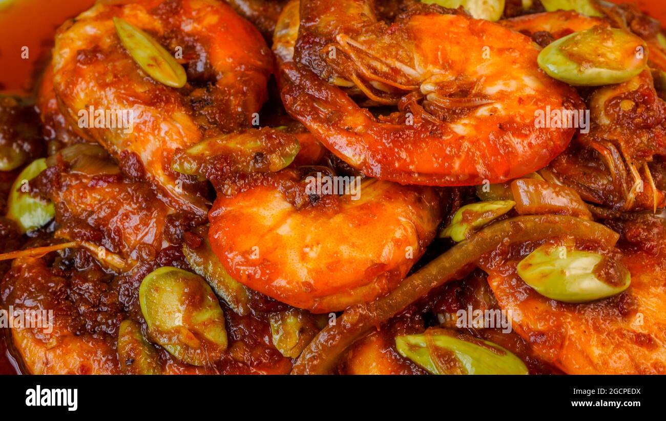 Delicious shrimp spicy dish with stinky beans known in Malaysia as Sambal Udang Petai. Stock Photo