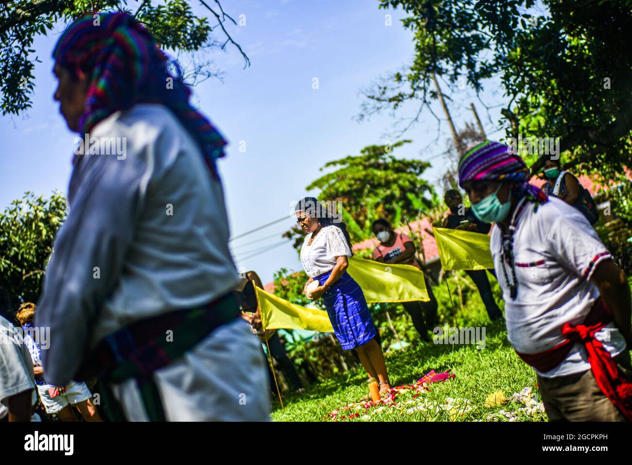 Izalco, El Salvador. 09th Aug, 2021. Indigenous people seen during the ceremony. Members of the Izalco Nahua organizations gathered in a ceremony to commemorate the International Day of the World's Indigenous Peoples on a sacred land where many indigenous people are buried and that once served as the town church. Credit: SOPA Images Limited/Alamy Live News Stock Photo