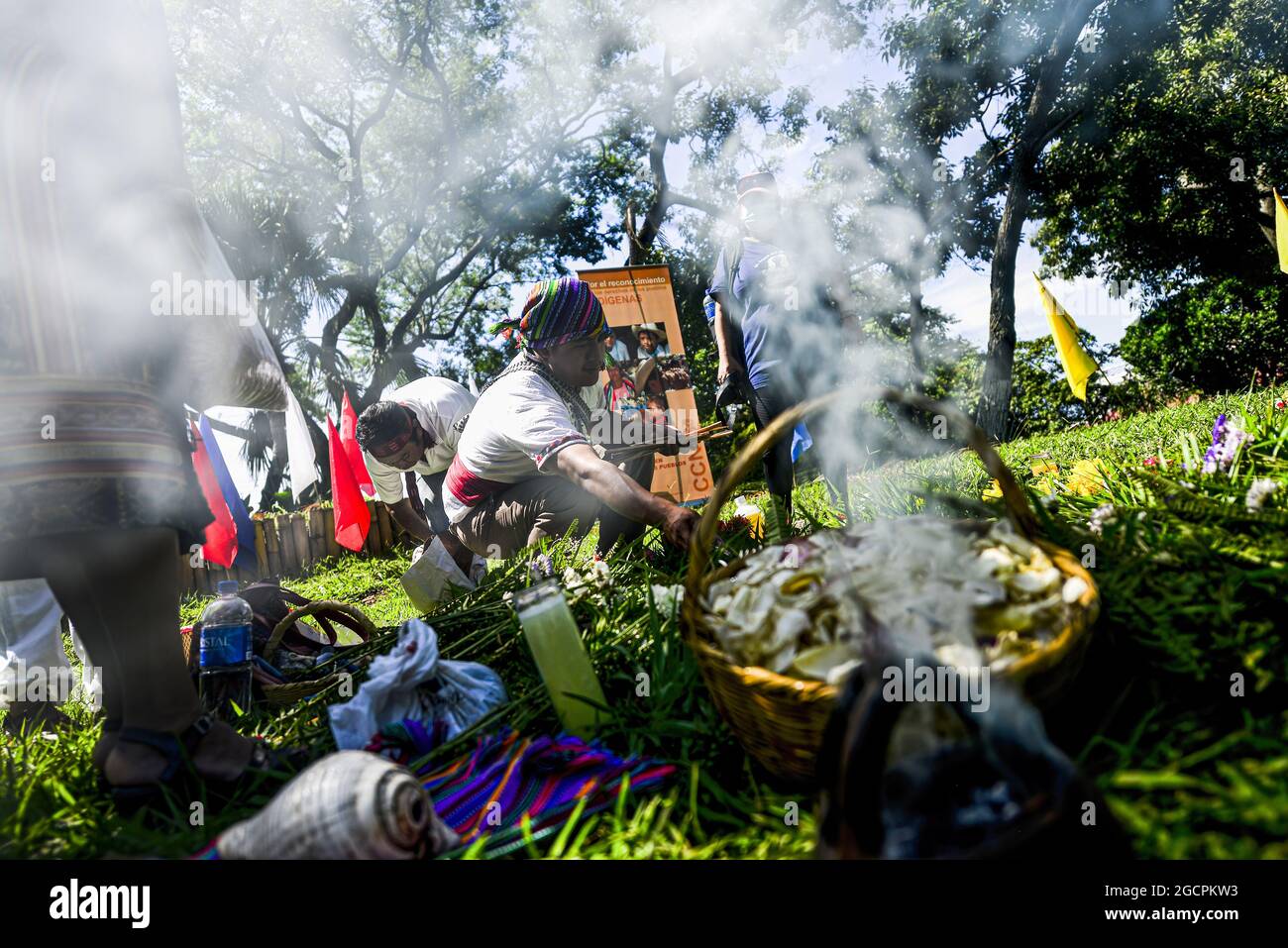 A 'tata' sets up an altar for the ceremony. Members of the Izalco Nahua organizations gathered in a ceremony to commemorate the International Day of the World's Indigenous Peoples on a sacred land where many indigenous people are buried and that once served as the town church. (Photo by Camilo Freedman / SOPA Images/Sipa USA) Stock Photo