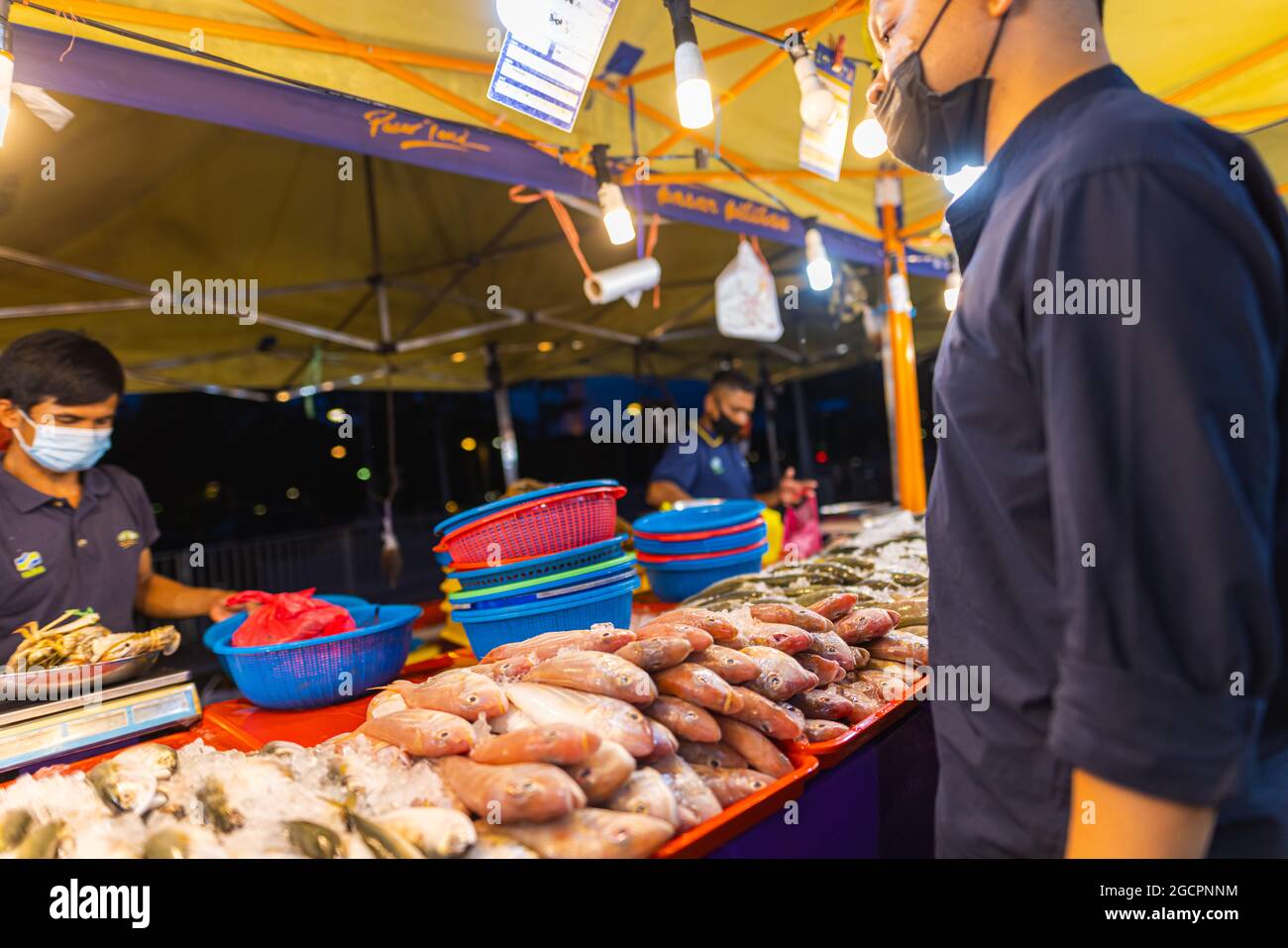 Street food night market at Putrajaya, near Kuala Lumpur. Salesman with