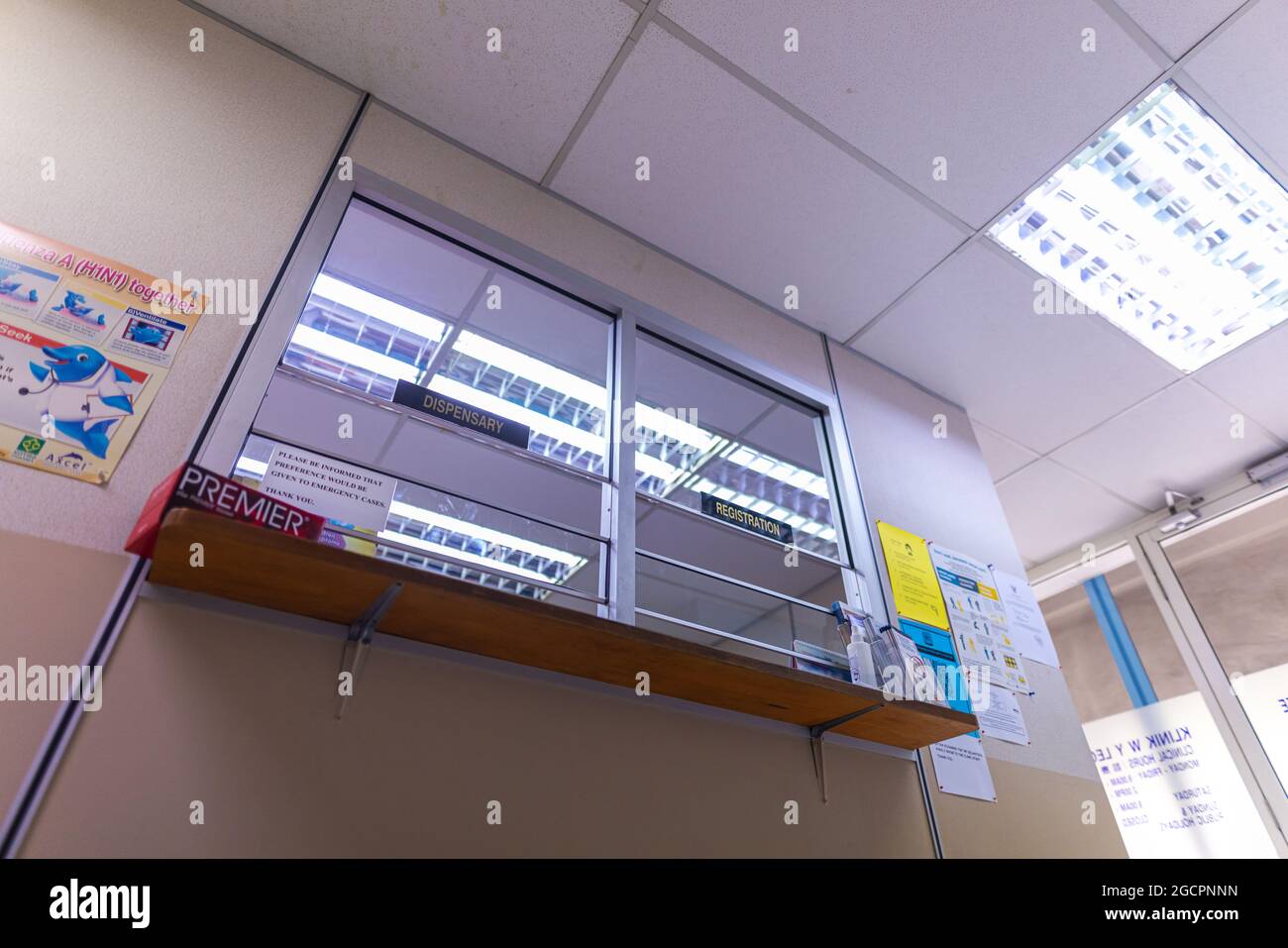 The reception desk of a polyclinic in Kuala Lumpur. The entrance lobby of a clinic in Malaysia. Patients has to wait outside due to the corona crisis Stock Photo